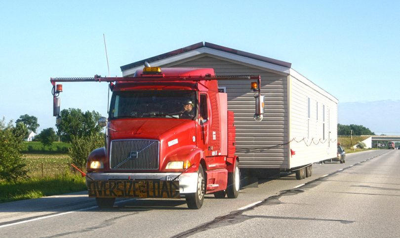 Modular home being transported