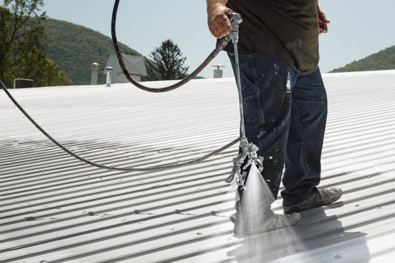 Spraying roof coating